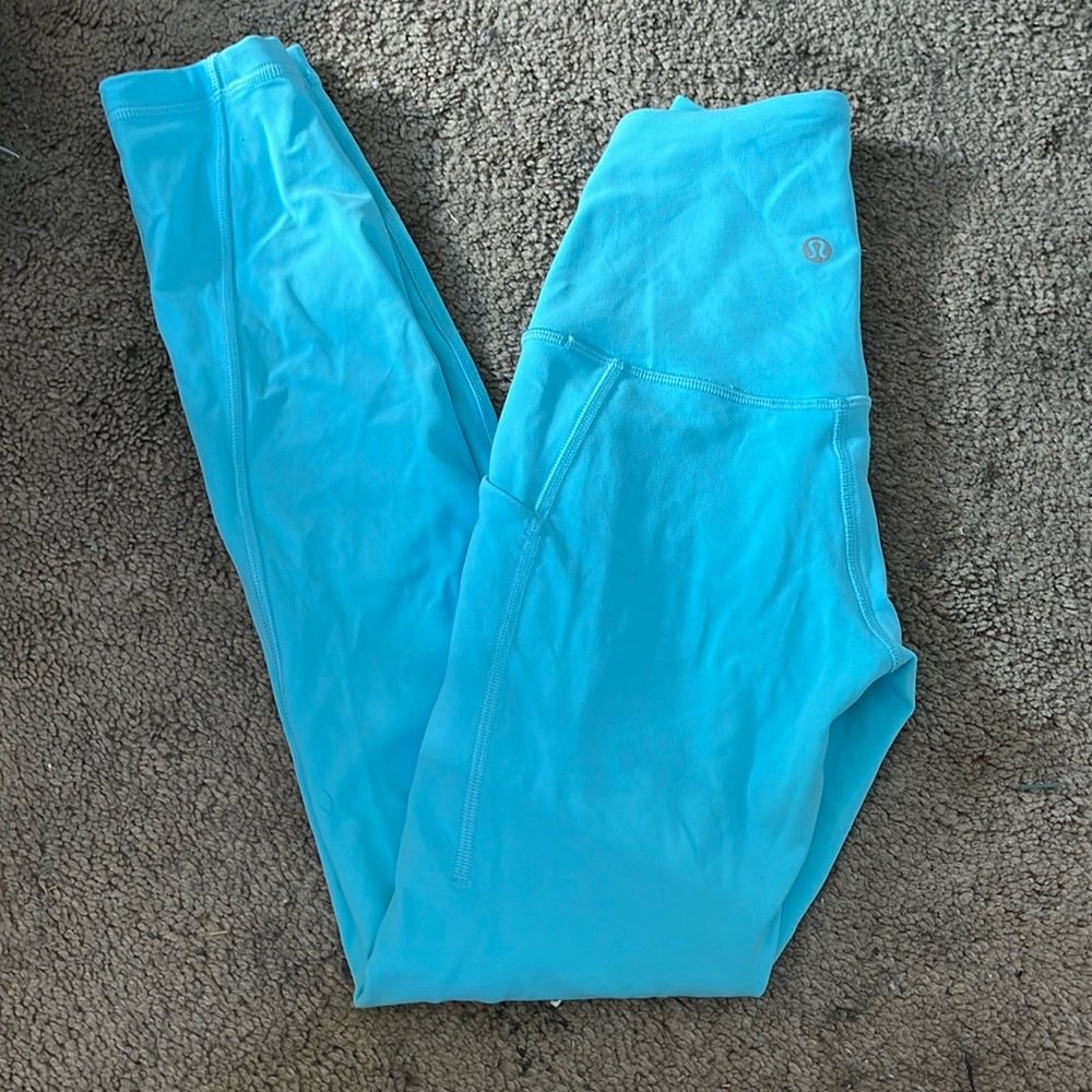 bright teal/blue LULULEMON leggings